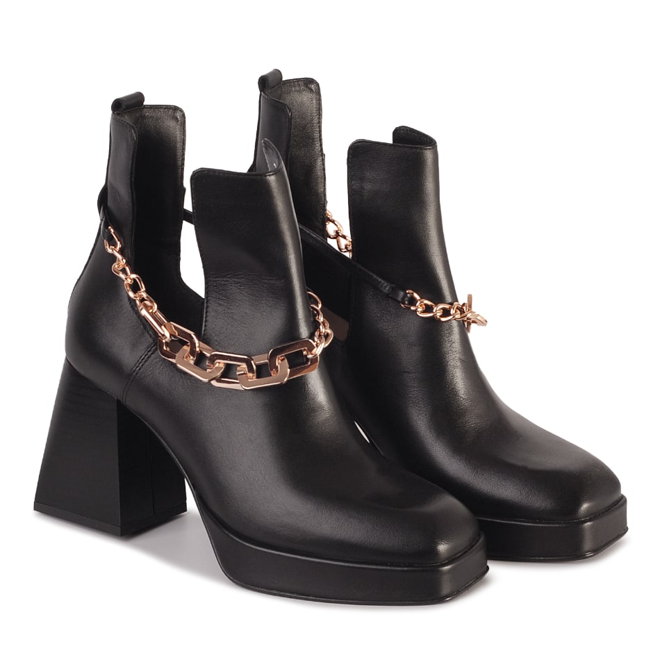  Black leather boots with cutouts
