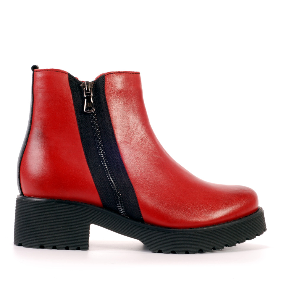 Red leather boots with a decorative zipper on the side