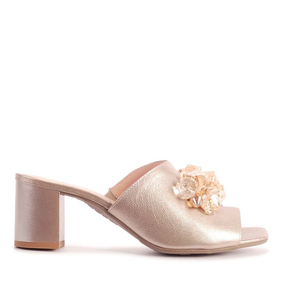 Beige leather slippers with an ornament