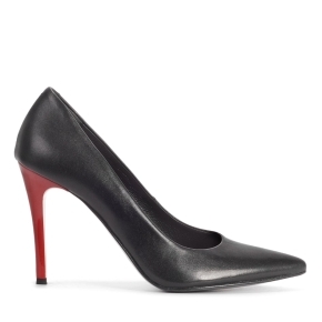 Black leather pumps on a red heel